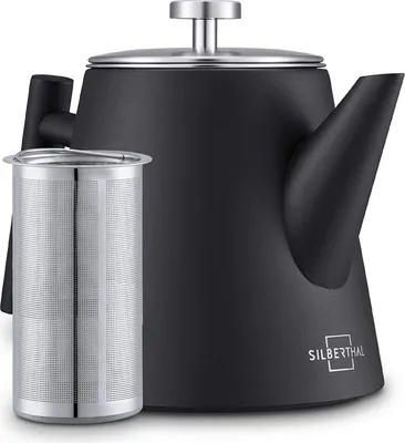 A black teapot with a silver lid and a silver tea infuser next to it, on a white background.