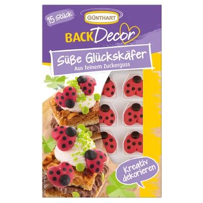A product package for cake decorations, featuring images of decorated cakes and the product itself.