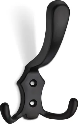 A black metal coat hook with two prongs and a decorative backplate.