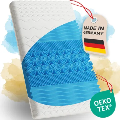 A cutaway view of a mattress topper showing its layered structure, with marketing tags indicating origin and certification.