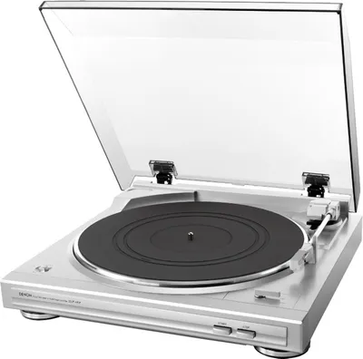 A silver Denon DP-29F turntable with its lid open, shown against a white background.