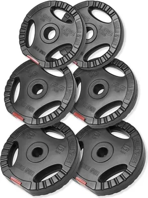 A set of weight plates arranged in a pyramid shape.