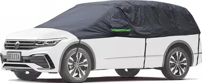 A white Volkswagen SUV covered by a dark gray car cover, shown from a side-front diagonal angle.
