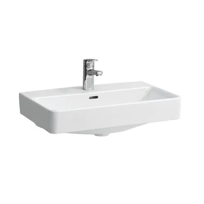 A white ceramic sink with a chrome faucet, isolated on a white background.