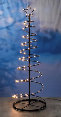 A spiral Christmas tree decorated with warm white LED lights and a star on top, set against a blurred blue background.