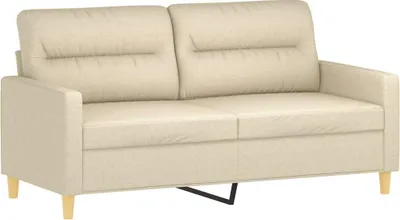 A studio shot of a cream-colored sofa.