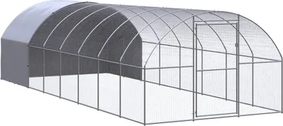 A long, arched greenhouse or chicken coop structure made of galvanized steel and transparent plastic sheeting.