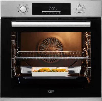 An open built-in oven with a dish of food inside.