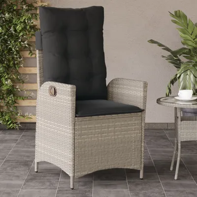 An outdoor patio scene with a chair and a small table.