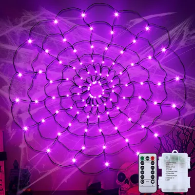 A purple spider web light decoration with a remote control and battery pack.