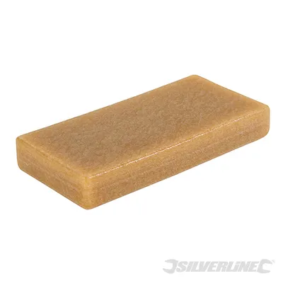 A rectangular block with a textured surface, likely for cleaning or sharpening.