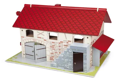 A toy farm building with a red roof and stone and wood details.