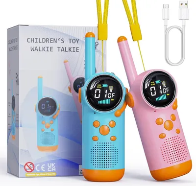 Two children's toy walkie-talkies, one blue and one pink, are displayed in front of their packaging. A USB charging cable is also visible.