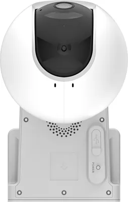 A white security camera with a black lens is shown from the front, mounted on a white base.