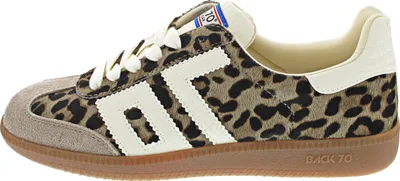 A side view of a single Adidas sneaker.