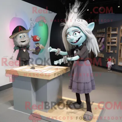 Productafbeelding van Mascot REDBROKOLY karakter van een grijze heks gekleed met een kokerrok en armbandhorloges