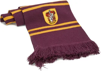 A Gryffindor scarf with fringe on a white background.