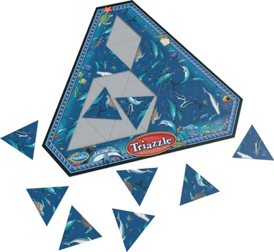 A triangular puzzle board with several loose triangular puzzle pieces scattered around it, all featuring an underwater scene with dolphins and other sea creatures.