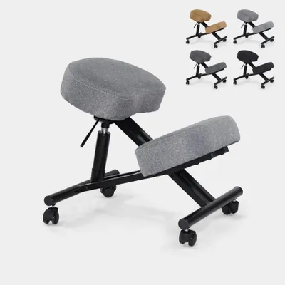 A grey ergonomic kneeling chair is shown against a white background. Several other chairs in different colors are visible in the upper right corner of the image.