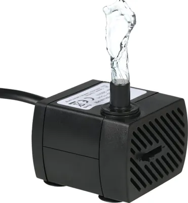 A black submersible water pump with water spraying from the top, set against a white background.