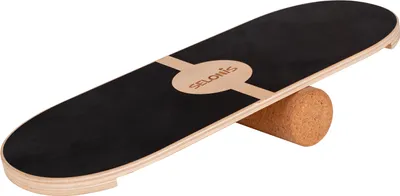 A balance board with a cork roller underneath, shown on a white background.