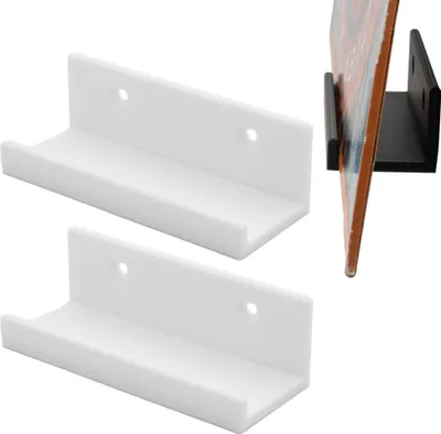 Two white L-shaped wall mounts are shown in the foreground, with a black L-shaped wall mount holding a vinyl record in the background.