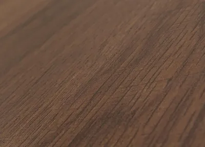 A close-up, angled view of a dark brown wooden surface, showing the grain and texture.