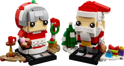Two Lego Brickheadz figures, Mr. Claus and Mrs. Claus, with Christmas-themed accessories.