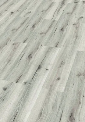 A close-up view of a light-colored wood-look floor.