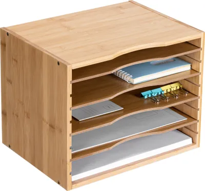 A wooden desk organizer with multiple shelves holding documents and office supplies.