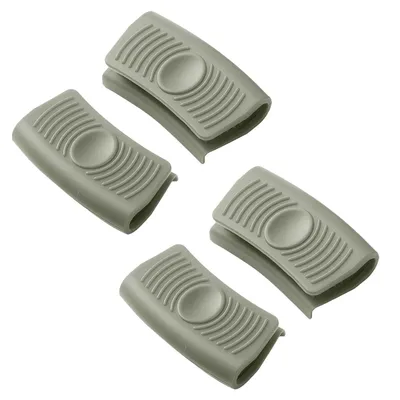 Four gray silicone pot handle covers are arranged in a diagonal pattern on a white background.