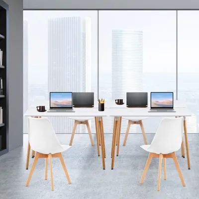 A modern office or dining room setting with a white rectangular table and chairs, set against a large window with a city view.