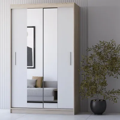 A modern wardrobe with mirrored doors in a room setting.