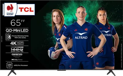 Three women in rugby uniforms posing in front of a TCL television screen.