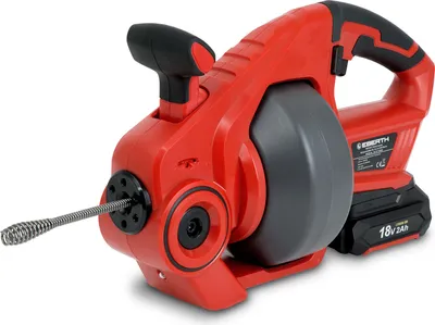 A red and black electric drain cleaning machine with a coiled metal snake extending from the front, set against a white background.