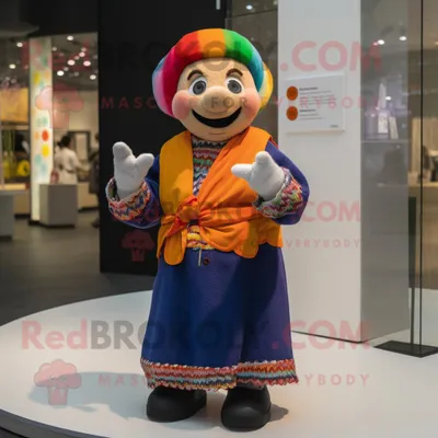 Immagine prodotto di Juggle personaggio del costume della mascotte REDBROKOLY vestito con un cappotto e fasce