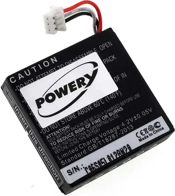 A close-up shot of a black lithium-ion battery pack with a white label and a white connector with red, white, and black wires.
