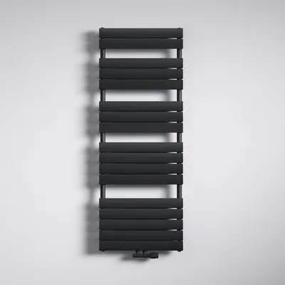 A black radiator mounted on a white wall.