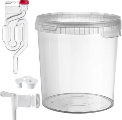 A fermentation bucket with accessories, including a airlock, spigot, and stoppers, displayed on a white background.