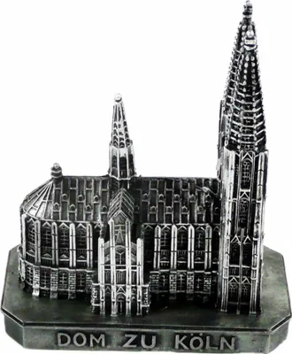 A silver miniature model of a cathedral, likely a souvenir, is displayed against a white background.