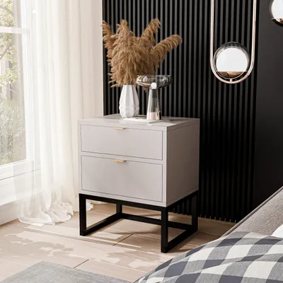A modern bedroom setting with a nightstand next to a window and a bed.
