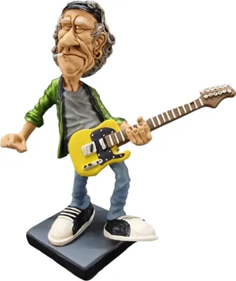 A caricature figurine of a rockstar playing a guitar.