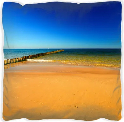 Produktbild von Wallario Premium Kissen, weiche Oberfläche, mit Motiv Sandstrand in orange - Blaues Meer - Blauer Himmel, Größe: 30 x 30 cm, mit weißer Rückseite