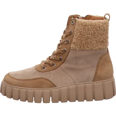 A side view of a brown lace-up boot with a shearling collar.