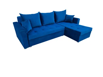 A blue sectional sofa with pillows is shown against a white background.