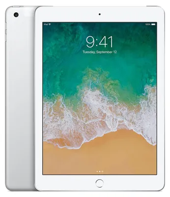 A silver Apple iPad is shown from the front and side, displaying the lock screen with a beach scene.