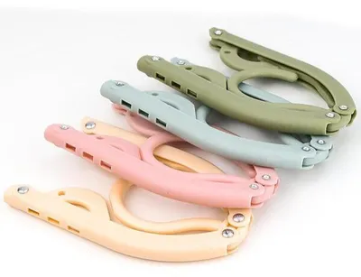 Produktbild von 12er Set Klappbare Platzsparende Kleiderbügel, Verstellbare Reisebügel für Babykleidung und Wintermäntel - FOLDGERS
