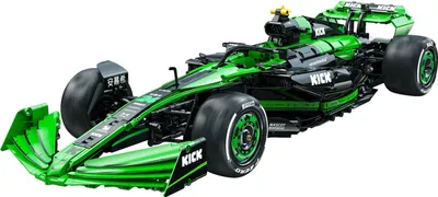 A green and black Formula 1 race car model.