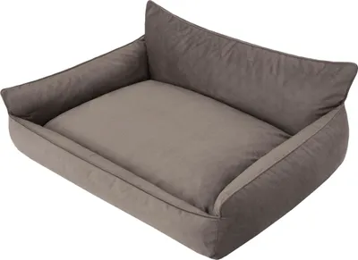 A dog bed with raised sides and a soft cushion.