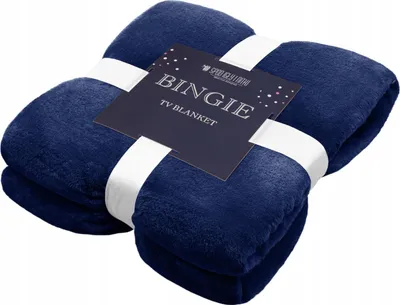 A folded navy blue blanket with a label attached.